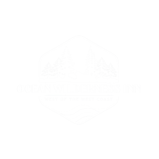 Ocean Wilderness Inn logo in white with lettering across the front, trees and small wave patterns.