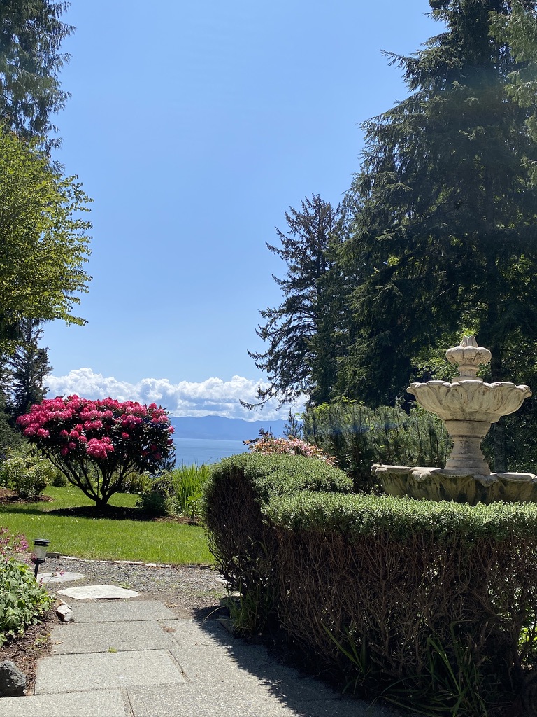 Oceanfront King Suite private garden patio and fountain at Ocean Wilderness Inn, Shirley BC.