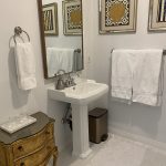 Modern en-suite bathroom in the Whale Watch Suite at Ocean Wilderness Inn, featuring bright vanity lighting and clean, private amenities for a relaxing Vancouver Island stay.