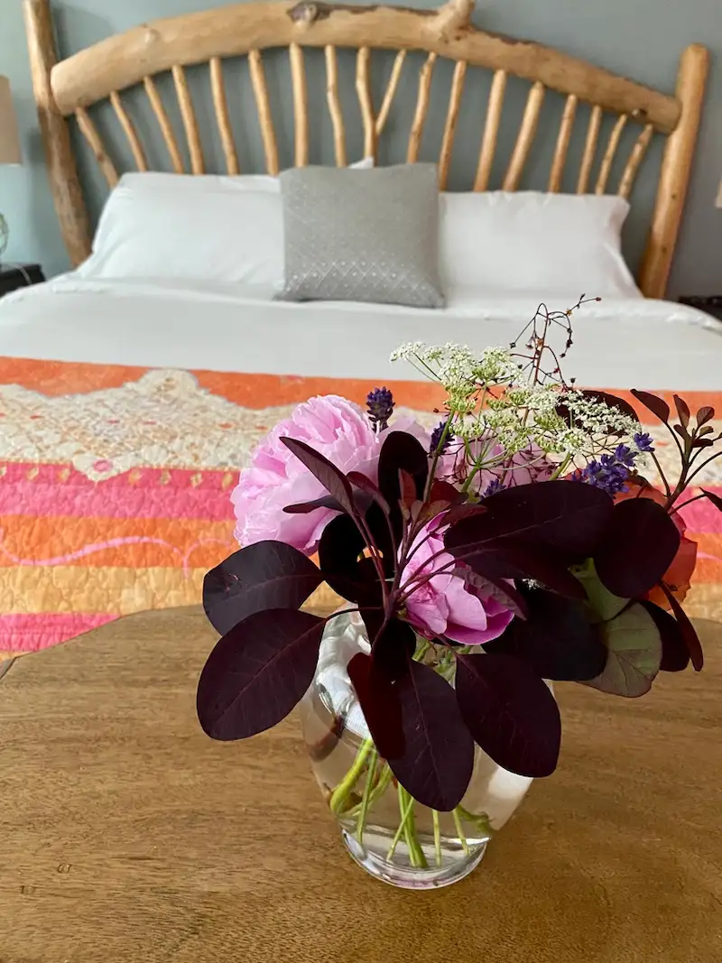Romantic fresh flowers in the Salish Sea Suite at Ocean Wilderness Inn.